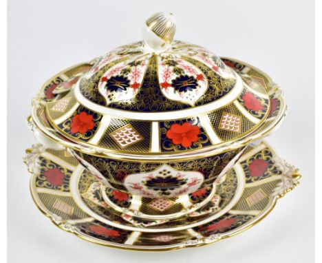 ROYAL CROWN DERBY; an ‘Old Imari’ pattern twin handled tureen, cover and stand, second quality, tureen diameter 31cm, stand d