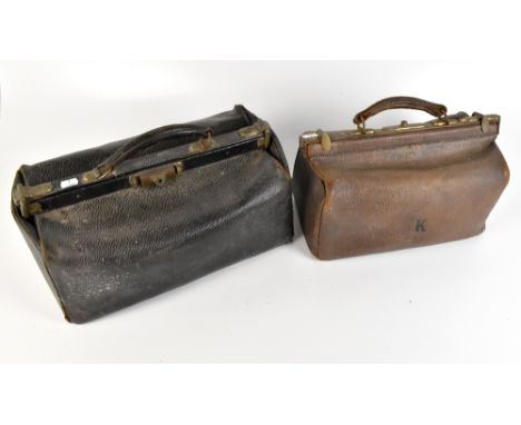 Two early 20th century Gladstone bags, the smaller initialled 'K', the larger with medical tools and accessories.Additional I