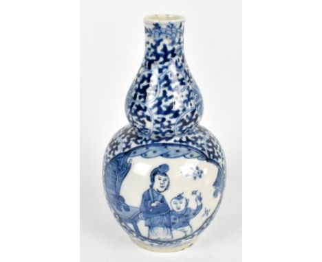 An early 20th century Chinese blue and white porcelain double gourd vase painted with figures inside scrolling detail, four c