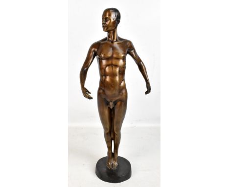 A mid-20th century bronzed sculpture of a nude male raised on circular plinth base, height 52cm, apparently unsigned.Addition