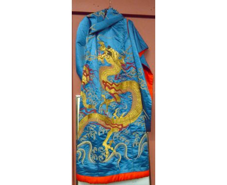 A Chinese silk kimono decorated with a three claw dragon and clouds on a predominantly blue ground.Additional InformationLigh