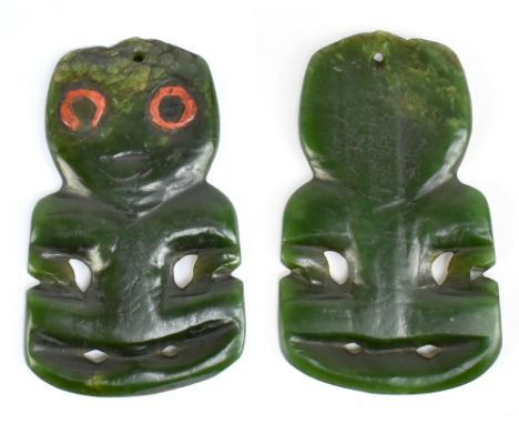 A rare 19th century Maori green stone hei tiki with red painted eyes, height 10.5cm, width at widest part 6.5cm.Provenance: f