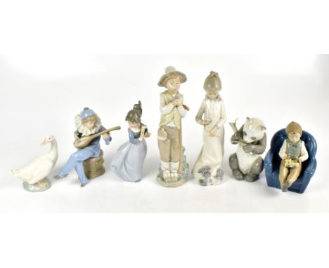 NAO; seven assorted figurines to include a boy seated playing with a train, etc.Additional InformationMinimal wear, light scr