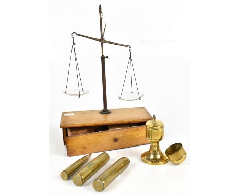 A cased set of glass scales and small brass square weights for drachms, a brass Hennessey’s Cognac advertising table lighter 