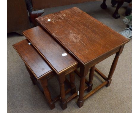 An oak nest of three tables, the largest 51 x 34cm, a modern gilt oval overmantel mirror with domed top and a glazed display 