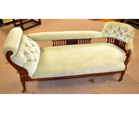 A late Victorian walnut framed chair end chaise longue in light green upholstery with carved detail on castors, length 170cm.
