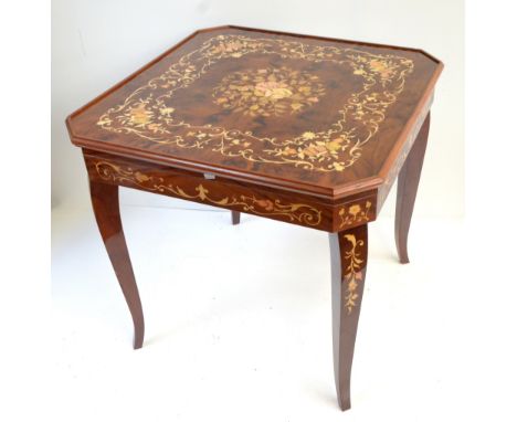 A reproduction Italian games table with simulated inlay, the top enclosing backgammon, chess and roulette surfaces, height 76