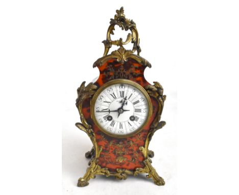 A 19th century French Boulle work mantel clock with applied gilt metal detail, the circular enamel dial with Arabic and Roman