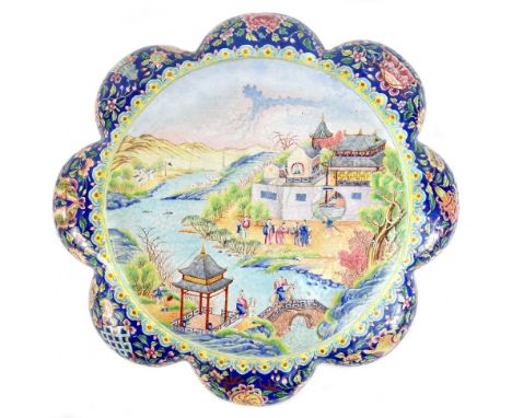 A rare 18th century Chinese Canton enamel lobed box cover, the central panel with landscape featuring two figures riding acro