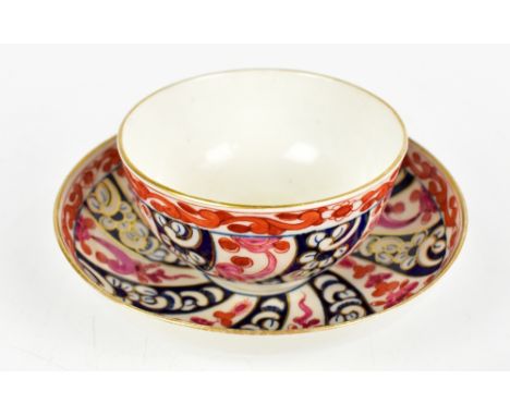 WORCESTER; an 18th century tea bowl and saucer painted in the 'Queen Charlotte' pattern, circa 1775, diameter of saucer 13cm.