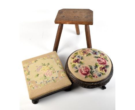 A Victorian mahogany framed footstool with tapestry top raised on four bun feet, length 36.5cm, a similar circular example an