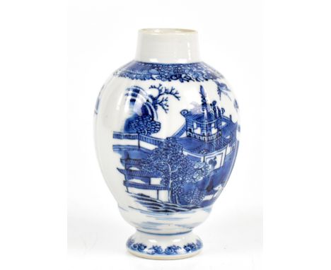 A Chinese blue and white lobbed ovoid vase decorated in the willow pattern and raised on a circular foot, unmarked, height 12