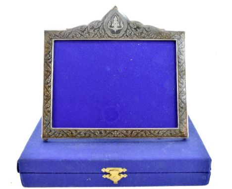 THAINAKON; a sterling silver and niello enamel photograph frame featuring Buddha and foliate scrolls, maker's mark, logo and 