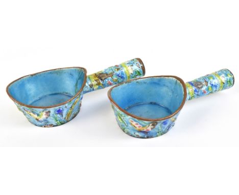 A pair of 20th century enamel on copper bowls with side handle, relief decorated with birds and insects, length 14cm.Addition