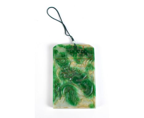 A Chinese carved jade plaque decorated with fish, duck and floral sprays to one side and a dragon to the reverse, 11 x 7.5 x 