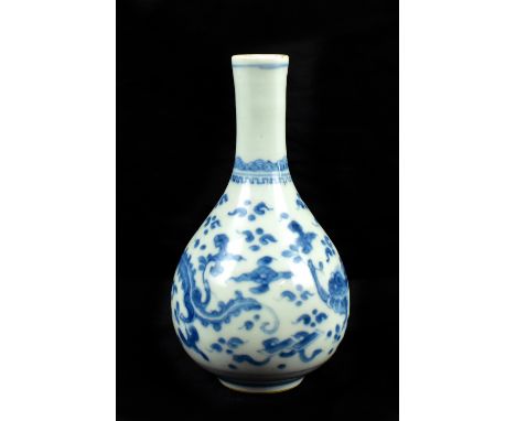 A late 19th/early 20th century Chinese blue and white porcelain baluster vase decorated with a pair of dragons amongst clouds