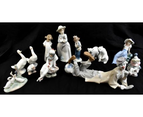 LLADRO; four figures comprising a recumbent clown with beach ball, length 35cm, a pierrot and two polar bears, also nine furt