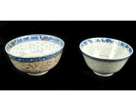 Two Chinese 'rice inset' bowls both with painted four character Kangxi marks to base, diameter 10.5cm and 11.5cm (2).Addition