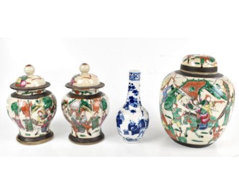 A 20th century Chinese three piece garniture comprising large central ginger jar and cover, height 26cm, and a pair of temple