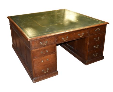 HOLLAND &amp; SONS OF LONDON; a good Edwardian oak twin pedestal partners' desk, with gilt tooled leather top above arrangeme