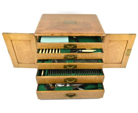 GEORGE MAKIN &amp; SON; an oak cased table canteen with silver plated cutlery including knife rests with ivory terminals, etc