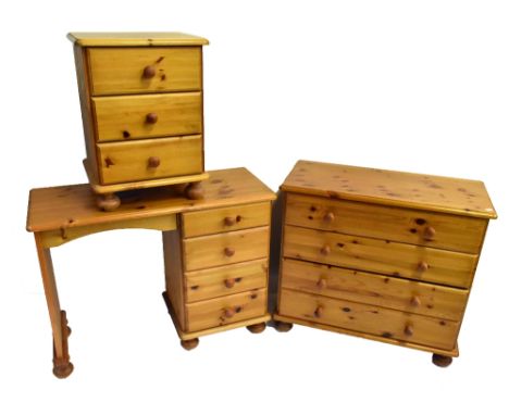 A modern pine three piece bedroom suite comprising knee hole dressing table, 72 x 96 x 38cm, a chest of four drawers and a be