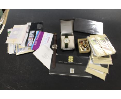 TWO WRISTWATCHES, A COLLECTION OF CUFFLINKS & STUDS + A SMALL QUANTITY OF POSTCARDS, BRITISH FIRST DAY COVERS ETC