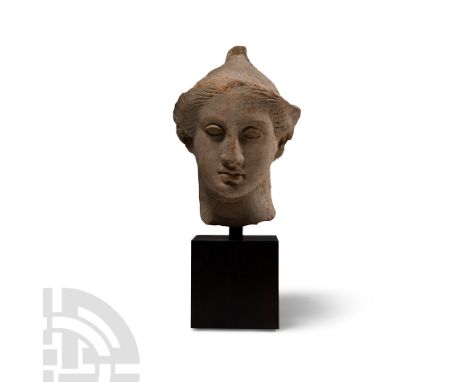 Mid 4th century B.C. Possibly depicting Ganymede or Paris, wearing a soft Phrygian cap with everted brim, the hair swept back