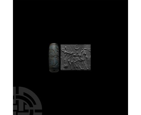 Neo-Assyrian Empire, 934-609 B.C. Fusiform with hunting scene, standing figure infringed robe drawing a bow at an antelope. C