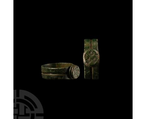 15th-16th century A.D.. The flat-section hoop with raised circular seal bezel bearing engraved three fleur de lis flanked by 