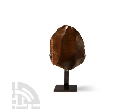 Lower Palaeolithic Period, circa 400,000 B.P.. A very thick, almost domed flint hand axe or heavy scraper formed on a blade c