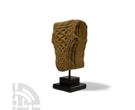 Circa 9th century A.D.. Portion of a lateral arm or head from a monumental cross of the Mercian Group with scoops at the junc