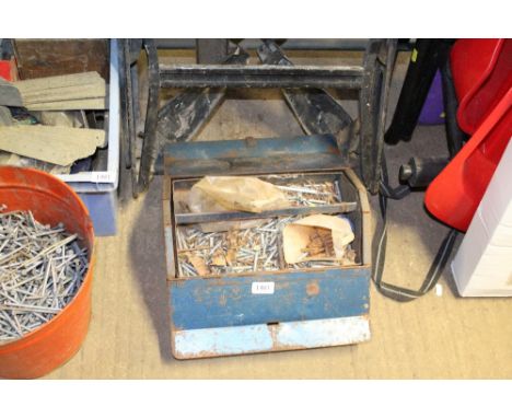 A metal tool box and contents of various screws