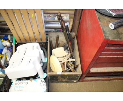 A wooden box and contents of various tools