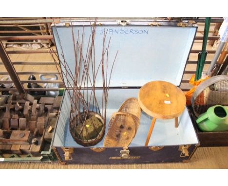 A storage trunk and contents of a stool, wicker basket and flower arranging basket