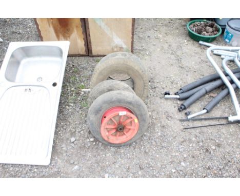A quantity of lawn tractor tyres and wheelbarrow tyres