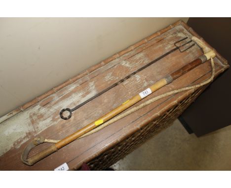 A horn handled white metal mounted riding crop and a toasting fork