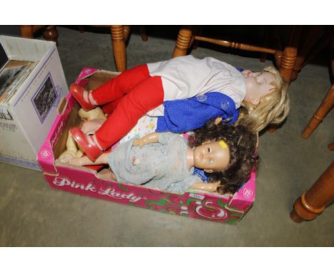 A box of vintage and other dolls
