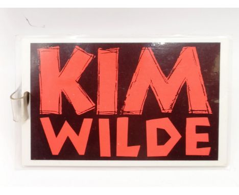 A Kim Wilde 1982 UK tour stage pass, the reverse reading Kim Wilde UK Tour Stage Pass, Jo Burt, and a second signature  We ar