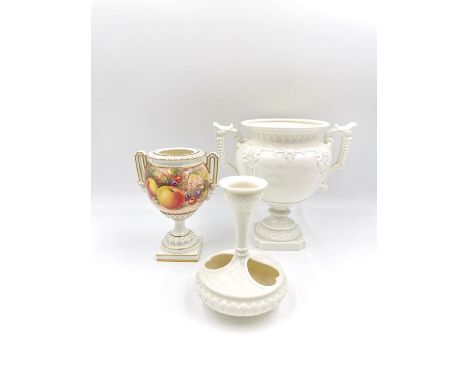A Royal Worcester heart bud vase/candlestick, along with two twin handled neoclassical style urns, one marked Royal Worcester