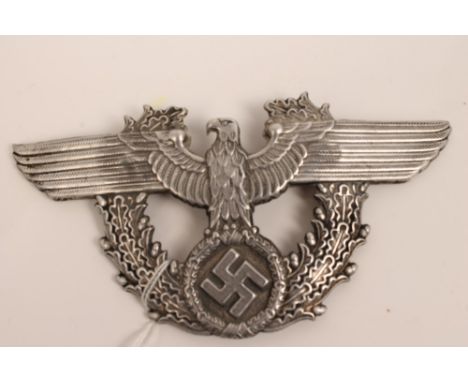 Nazi Police helmet plate / mount, with Nazi eagle in oak leaf and acorn border