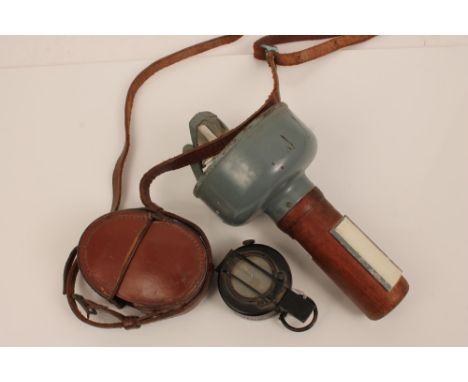 Second World War British prismatic marching compass,  no. 3034A on reverse, in original brown leather outer case, together wi