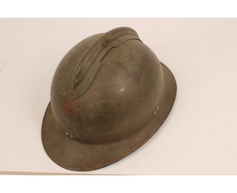 French First World War period tin helmet with camouflage painted top