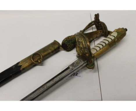 George V Naval Officers' dress sword with regulation gilt brass Gothic hilt with lion's head pommel, original dress knot, etc