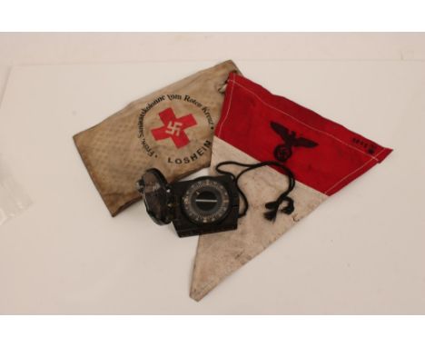 Second World War period German pocket compass in bakelite case, together with a reproduction Nazi Red Cross armband and penna