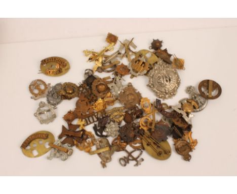 Collection of First World War and later British Military cap badges - various regiments including Essex Regiment and Argyll &