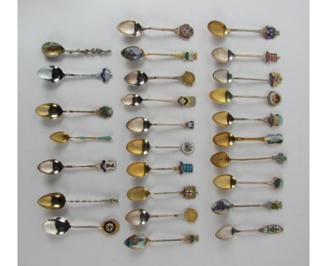 Box: A collection of 18 silver Novelty Teaspoons, each with enamel coat of arms of different cities and towns, and 9 others s