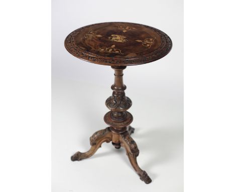 An early Victorian inlaid and carved walnut Occasional Table, with circular inlaid top and tripod base. (1)Provenance : Colon