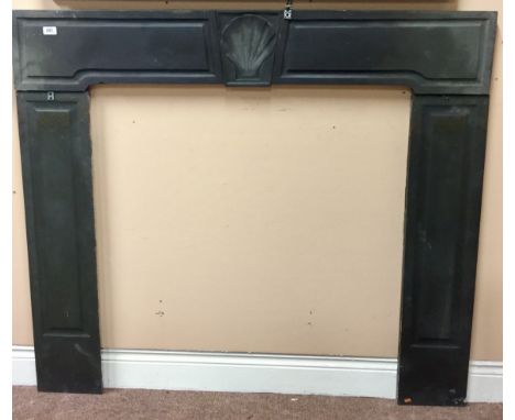 A Queen Anne / George I black slate marble Chimney Piece, with shell decorated centre panel and decorated uprights, approx. 1