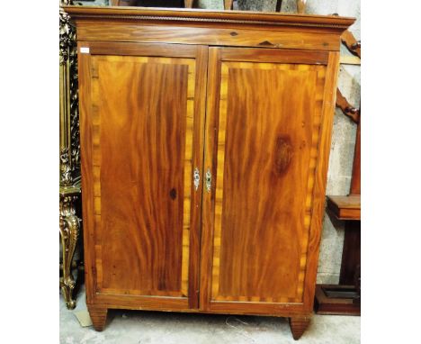 A 19th Century two door Wardrobe, the cornice with Greek key moulding, over two crossbanded panel doors, 132cms (52") wide; 1